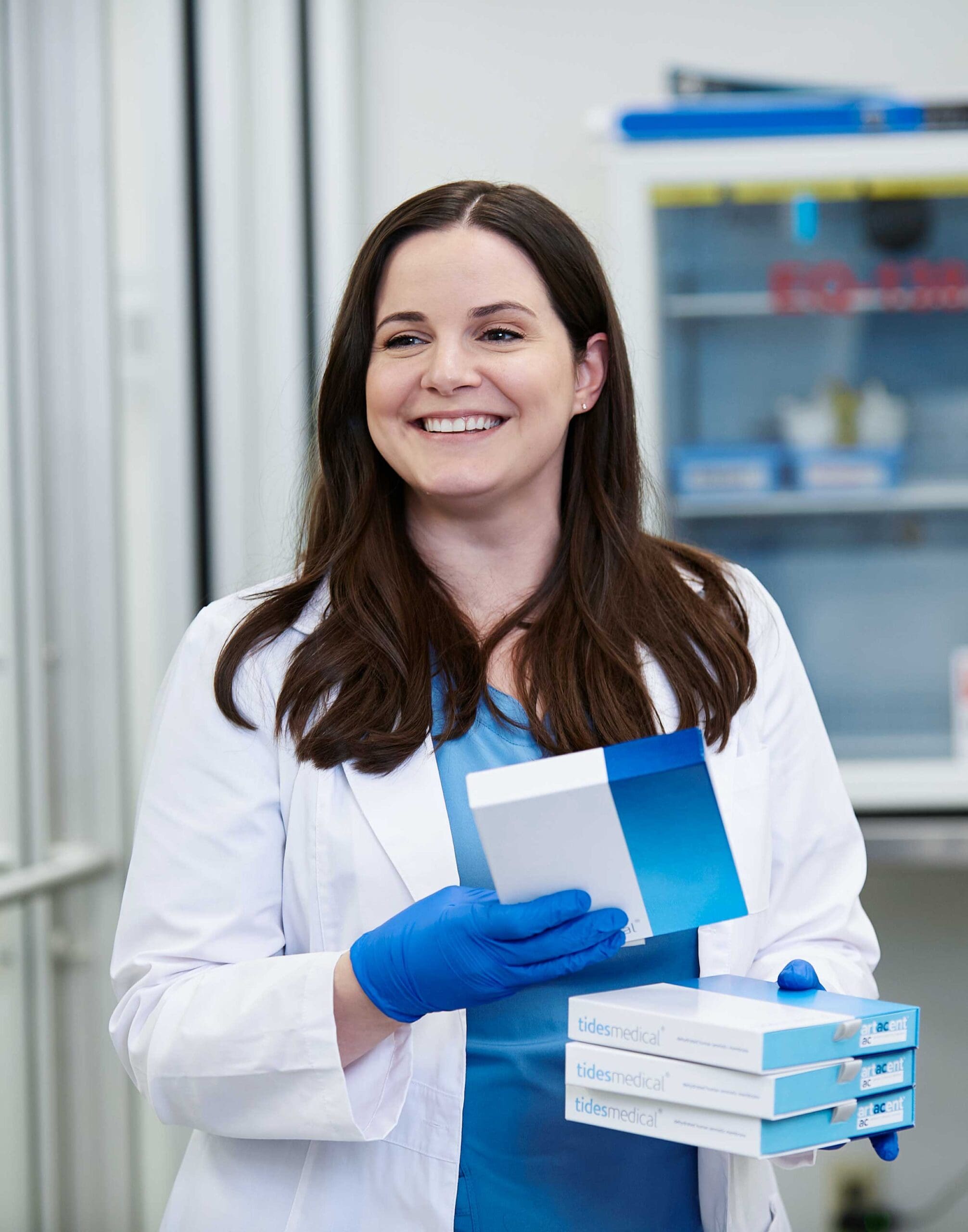 Clinician holds Tides Medical Artacent AC boxes